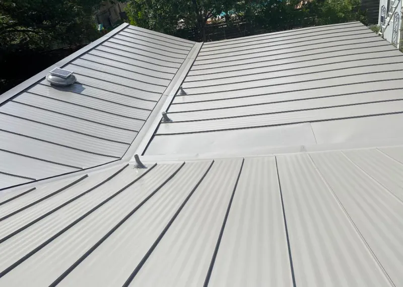 Solar attic fan installed on a metal roof for Roof Ventilation in Pleasure Point